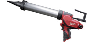 Eine moderne Fettpresse mit ergonomischem Griff und langem, zylindrischem Kolben in Rot und Grau.